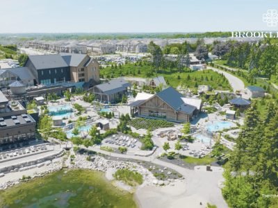 Luxurious outdoor spa retreat with thermal pools and wood-clad buildings at Thermëa Spa Village in Whitby, surrounded by lush greenery